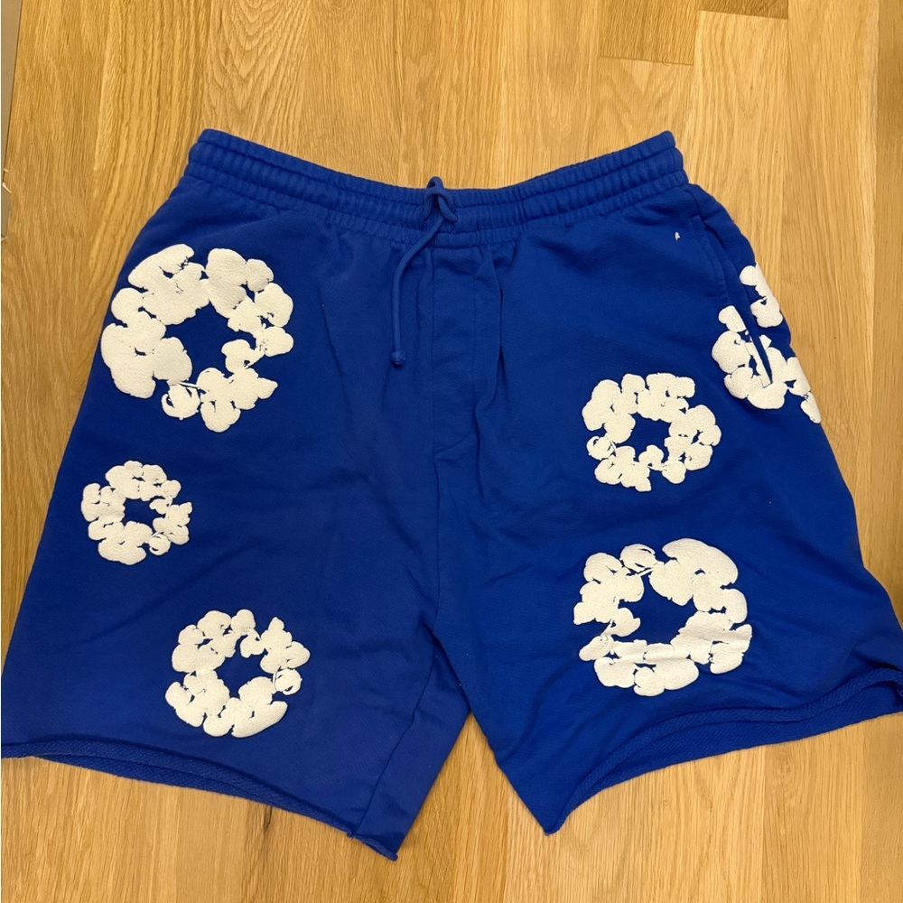 Denim Tears Blue Shorts with White Floral Patterns